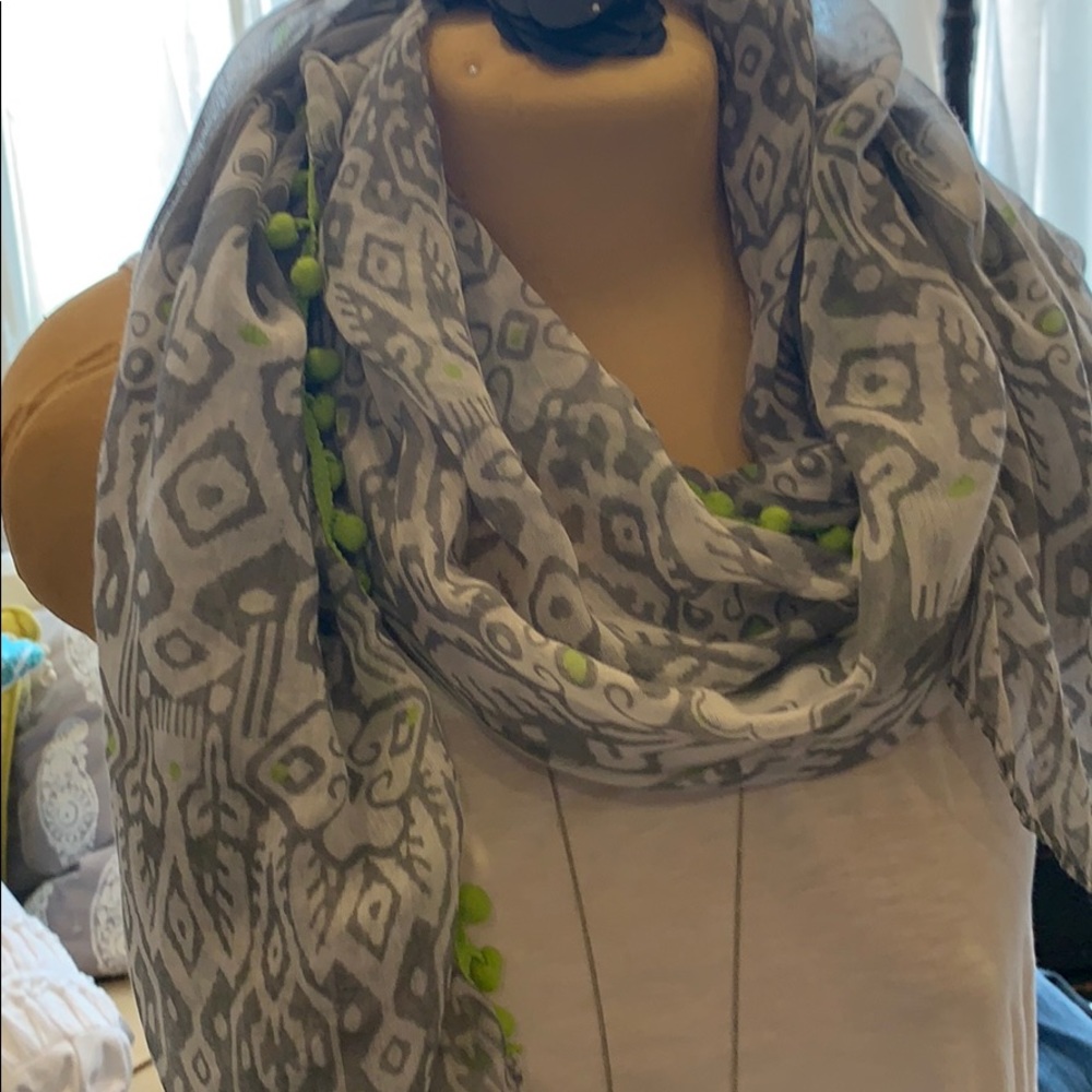 gray, White scarf trimmed with green pom poms